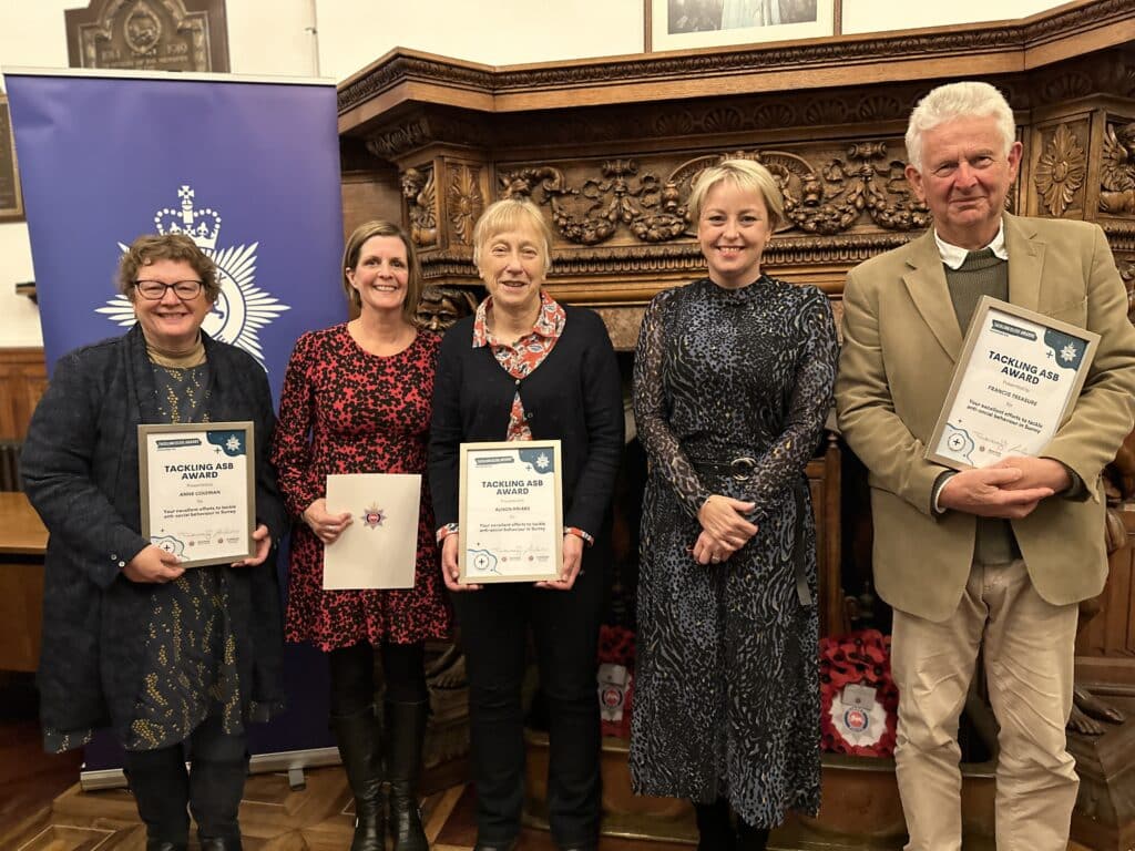 Lisa Townsend stands beside members of Catalyst Support's Cuckooing Service, who received awards at a Surrey Police ceremony to highlight efforts made to tackle anti-social behaviour.